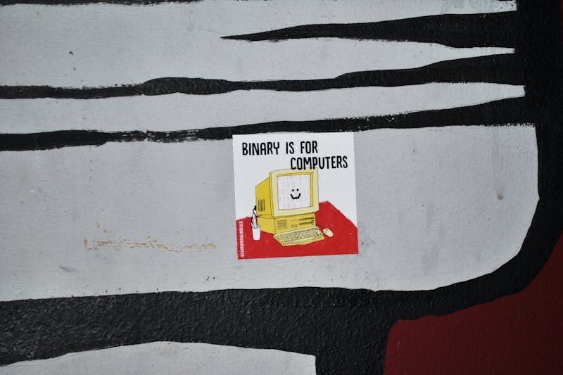 Binary is for computers sticker on a table at a bar