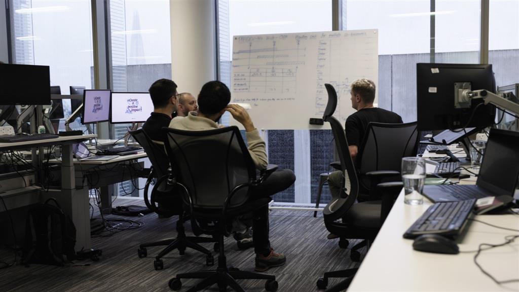 alfa co-workers in a planning meeting