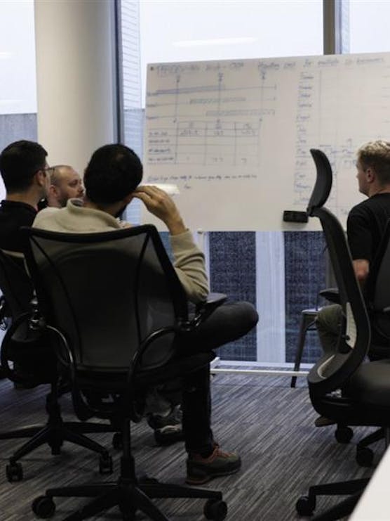 alfa co-workers in a planning meeting
