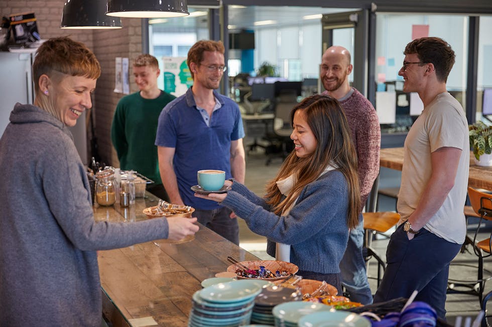 alfa employees enjoying coffee