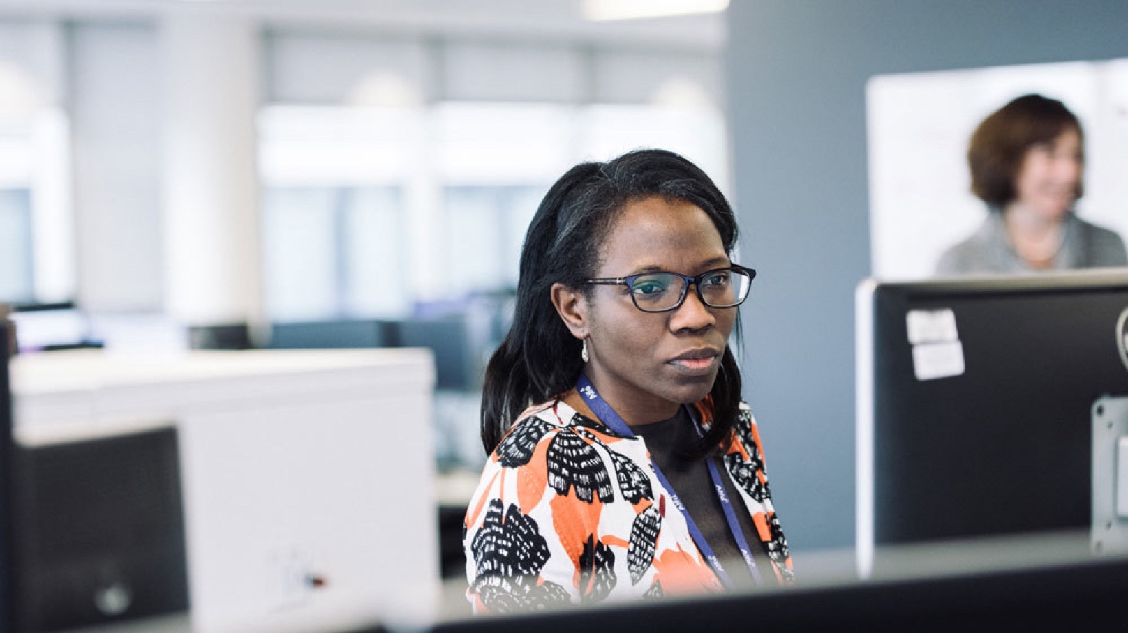 Female Alfa Employee Working at Desk