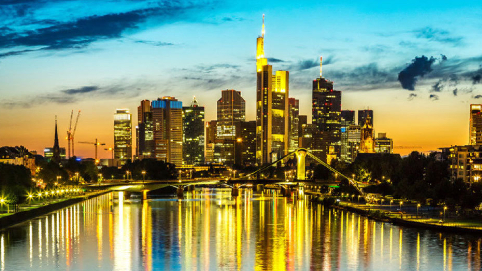 City of Frankfurt landscape at night with lights reflection on the river water