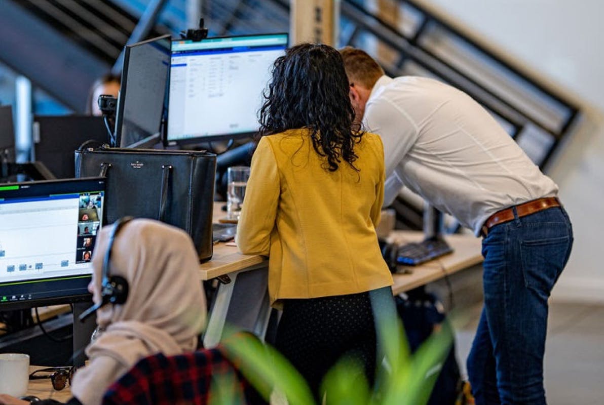 Alfa employees working on a project together