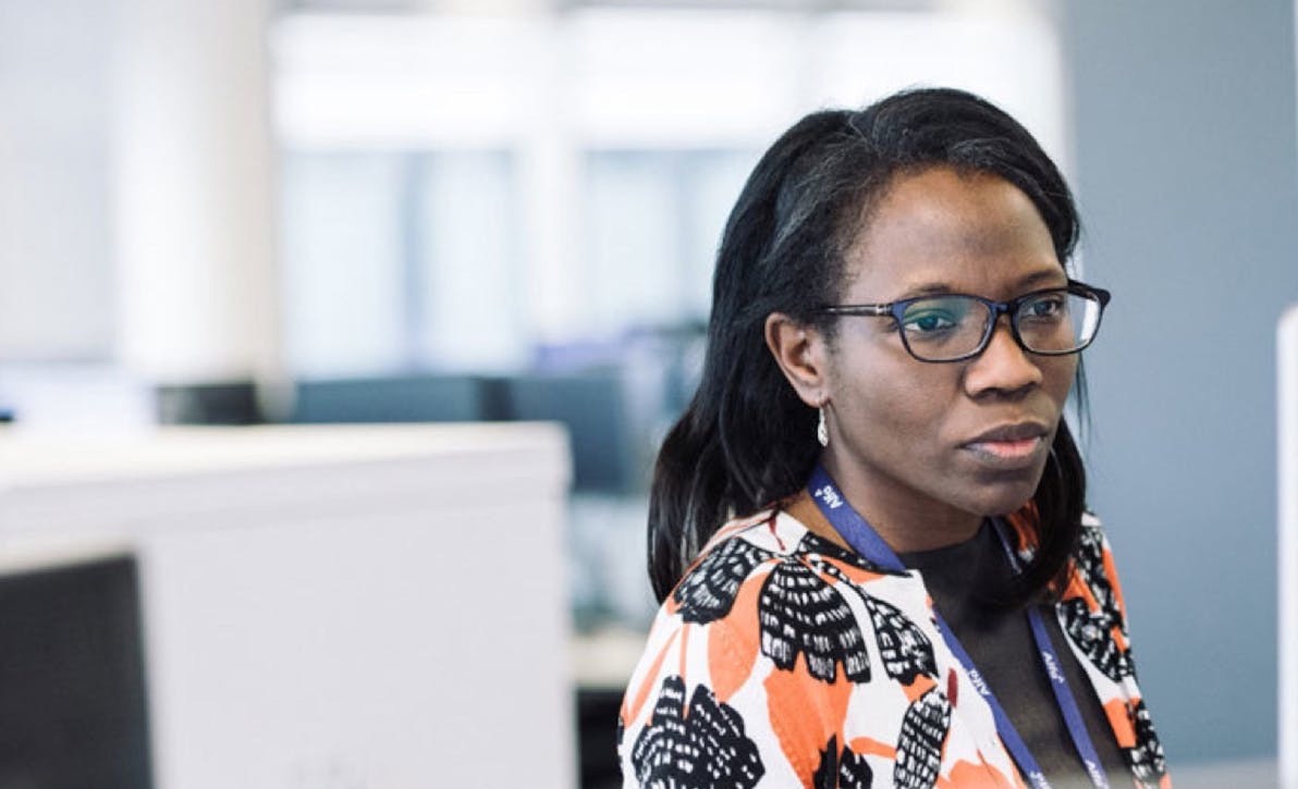 Female Alfa Employee Working at Desk