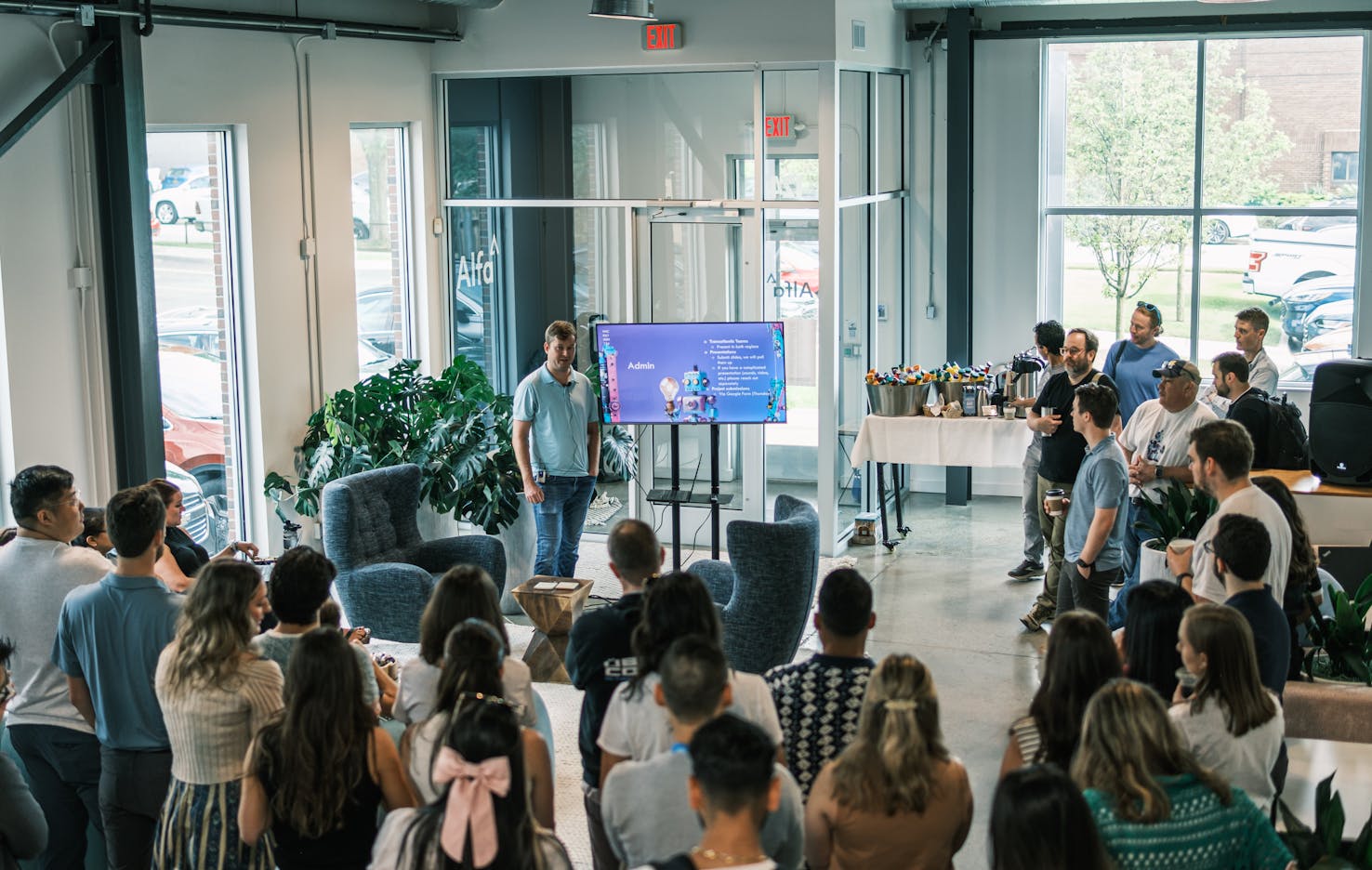 Alfa US Hackathon introduction presentation to team in office