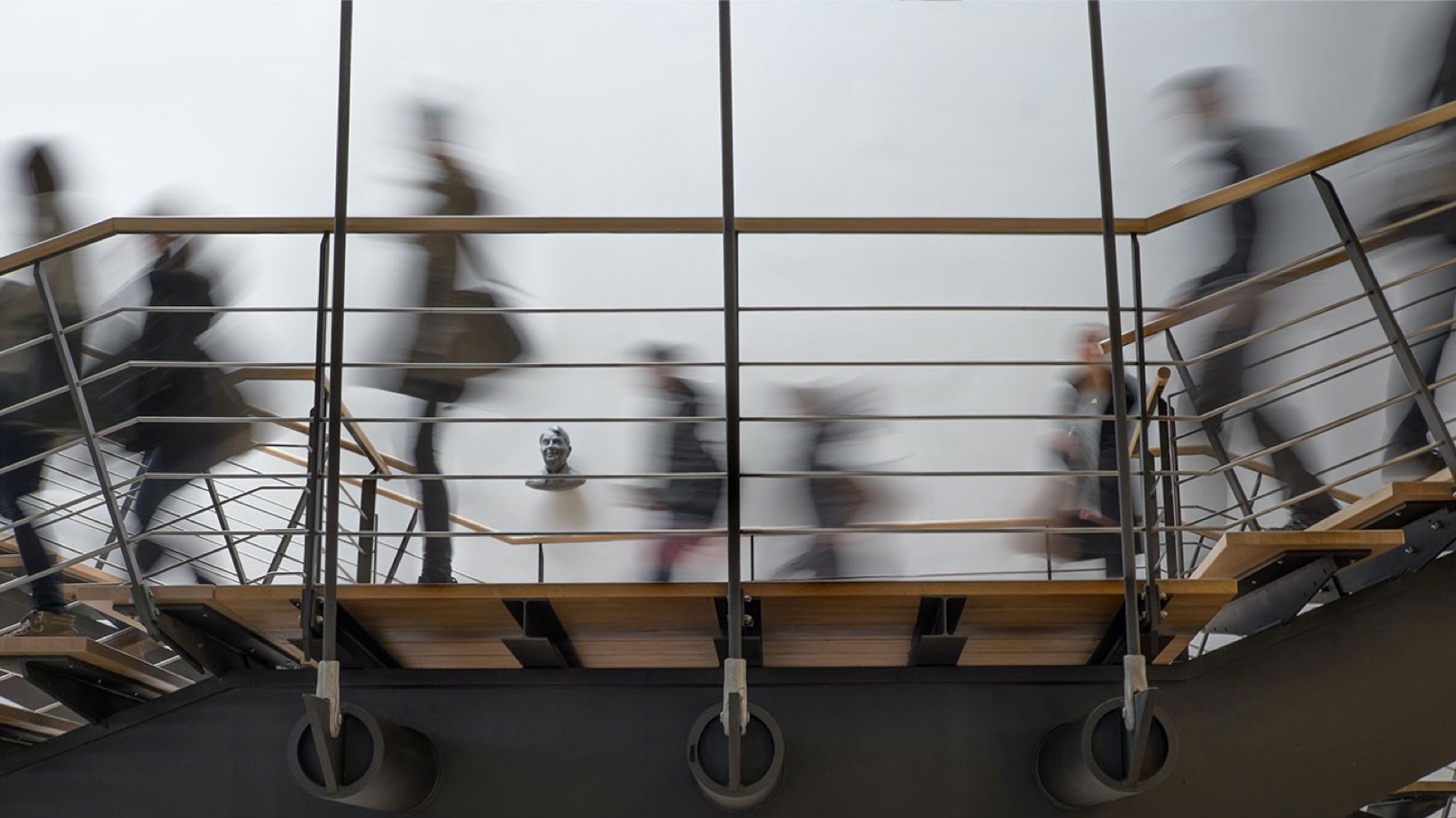 Busy People Walking Down Stairs