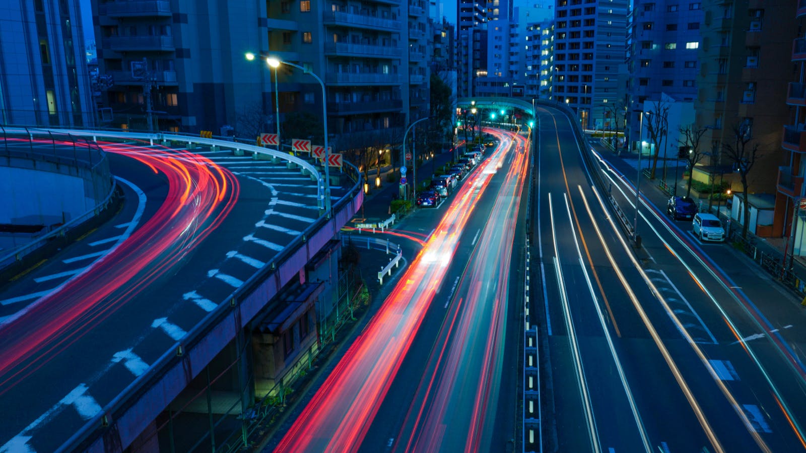 Time lapse photography of cars on a highway at night time