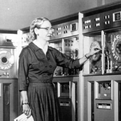 Grace Hopper with an old computer