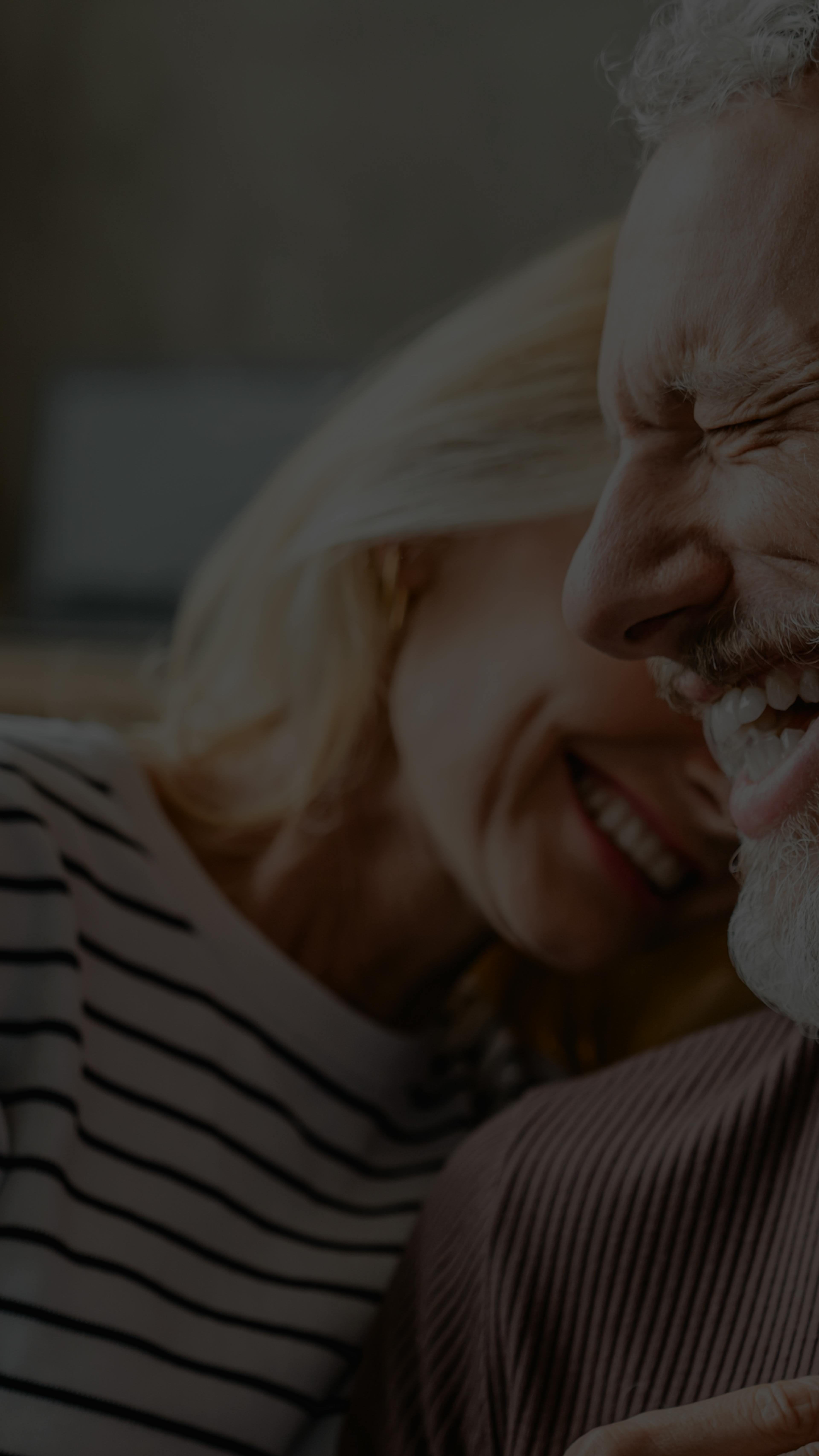 man and woman smiling