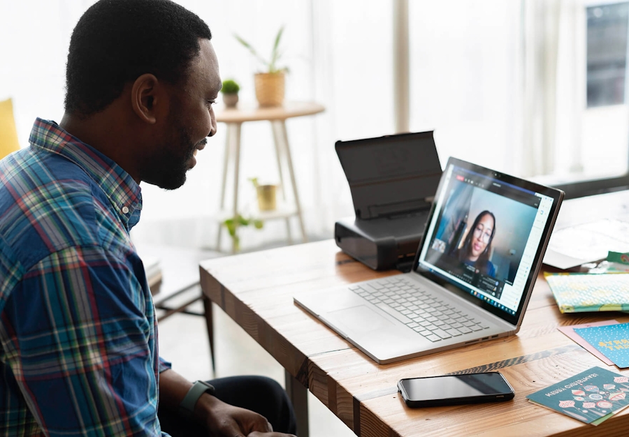 Man speaking on a video call with a woman