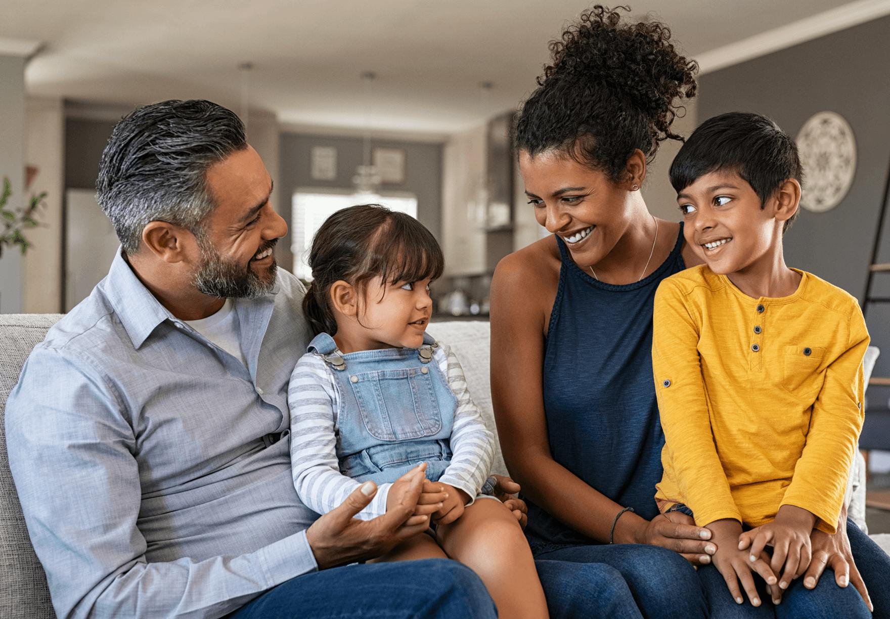 A happy family sharing a moment together in their living room