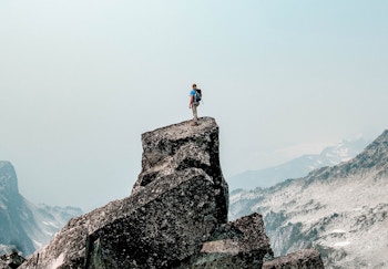 man standing on rocks