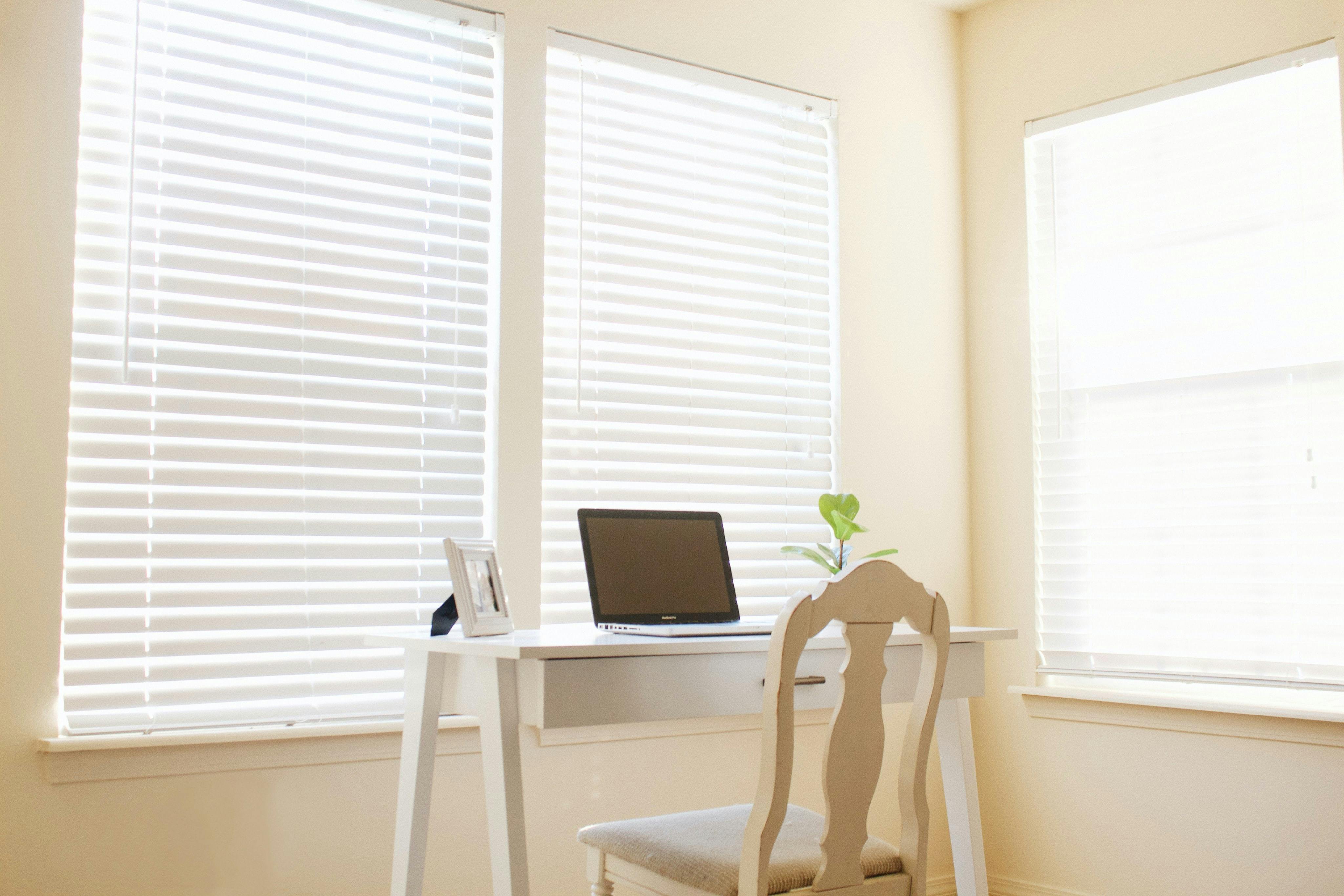 white chair and desk in a well-lit room