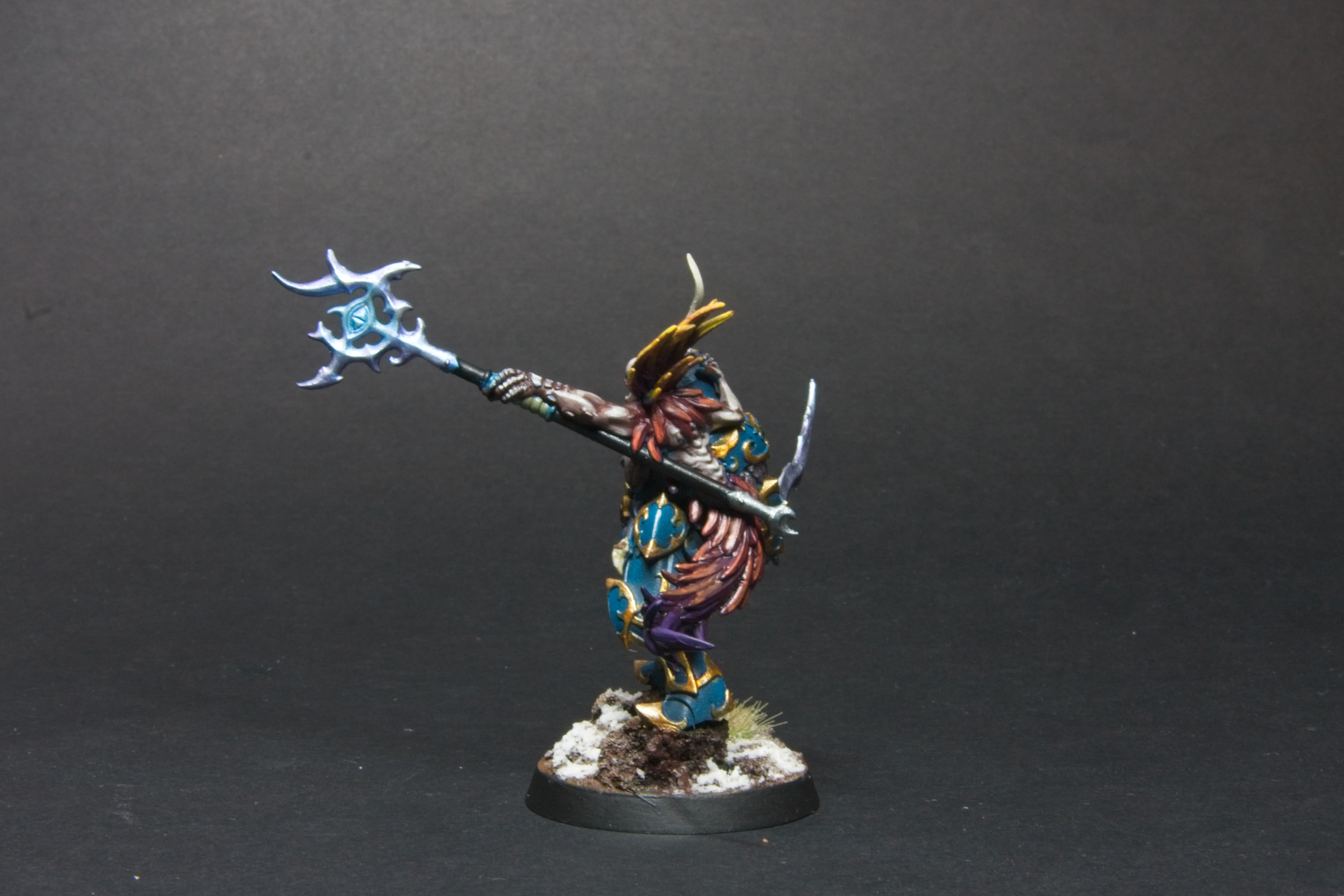 The staff wielded by the Curseling is silver, and has an iridescent glow.