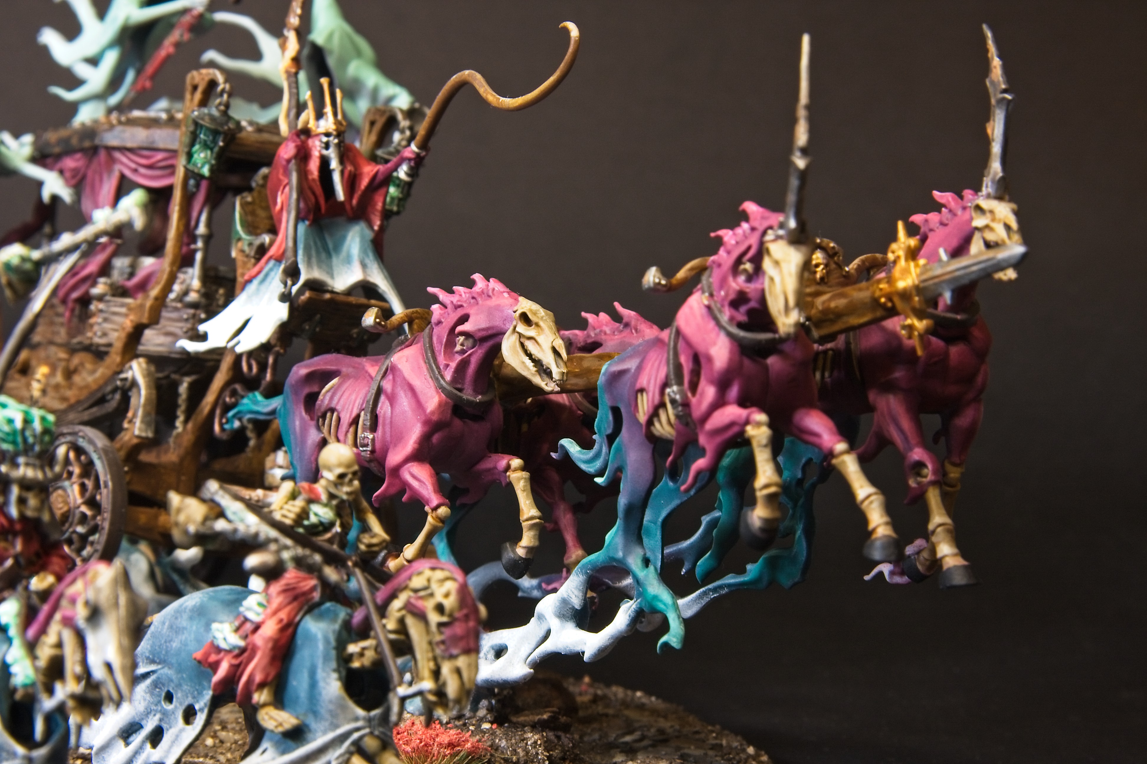 The black coach is being pulled by four horses, that change from blue mist to red flesh and bones.