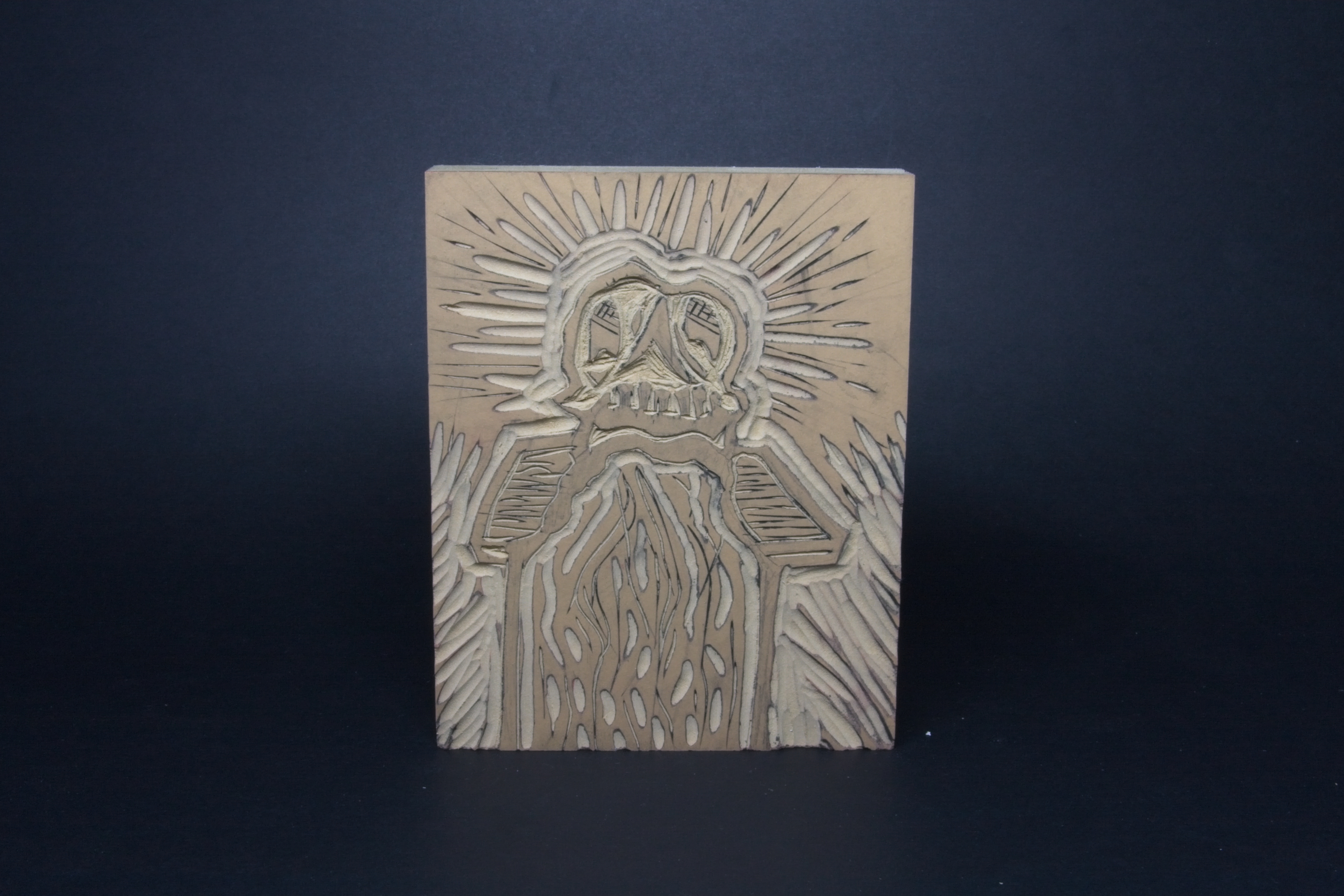 A skull on a table puking out a flow of liquid.