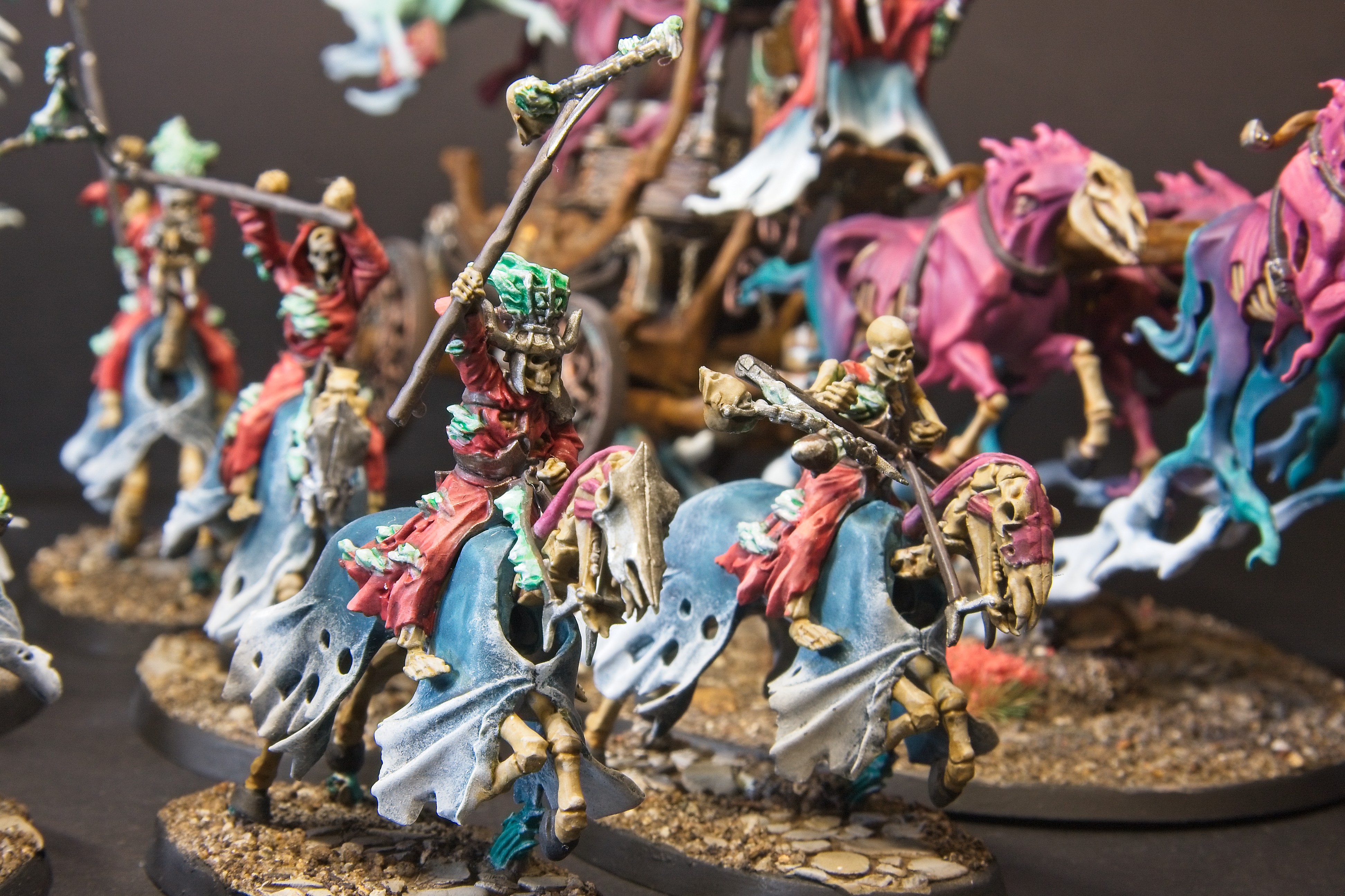 These hexwraiths are dressed in red, and charge with the black coach into battle.