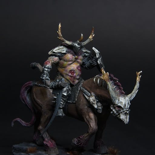 A mounted chaos lord, wielding a large sickle while riding a demonic horse.