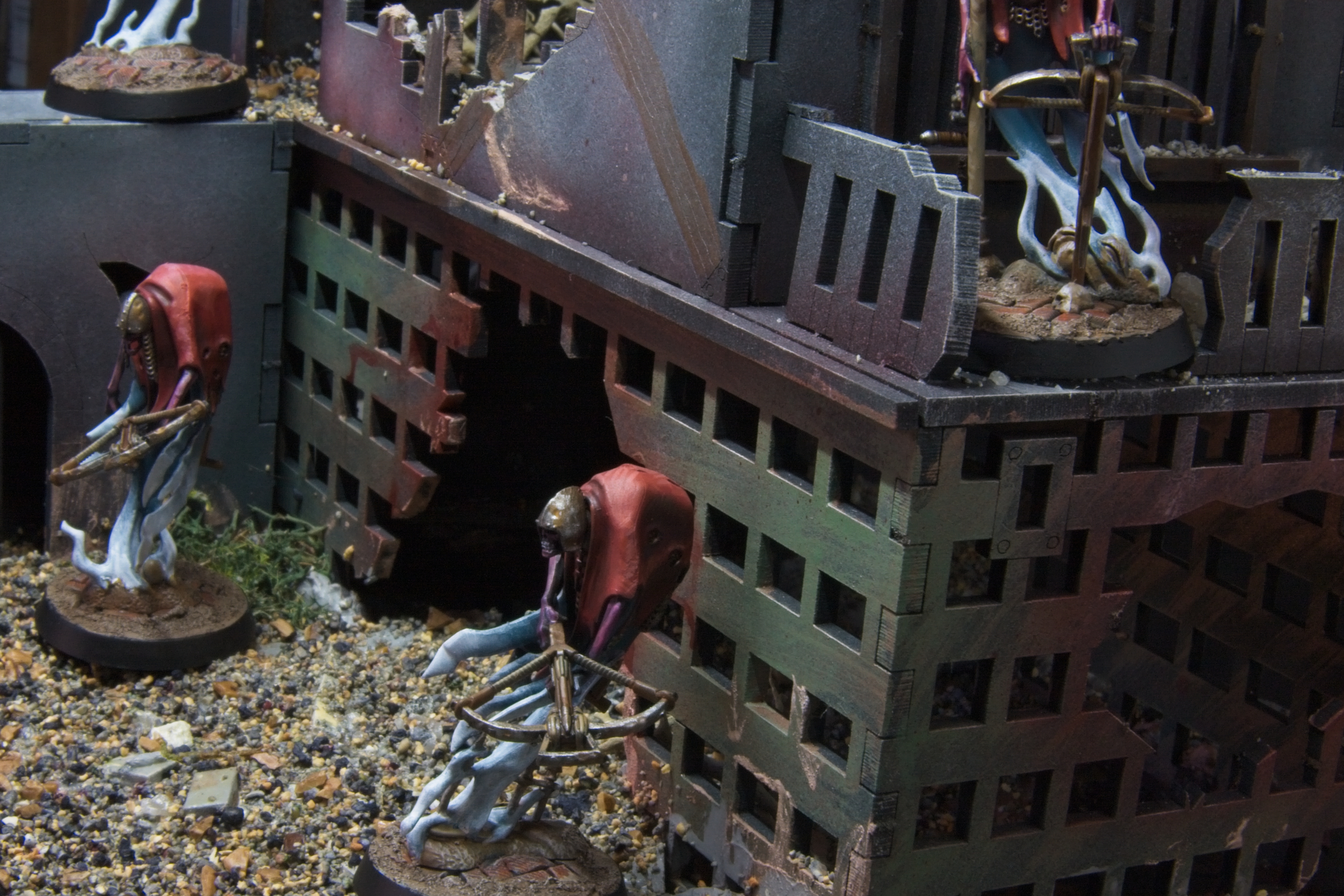 Two ghosts by a metallic barricade