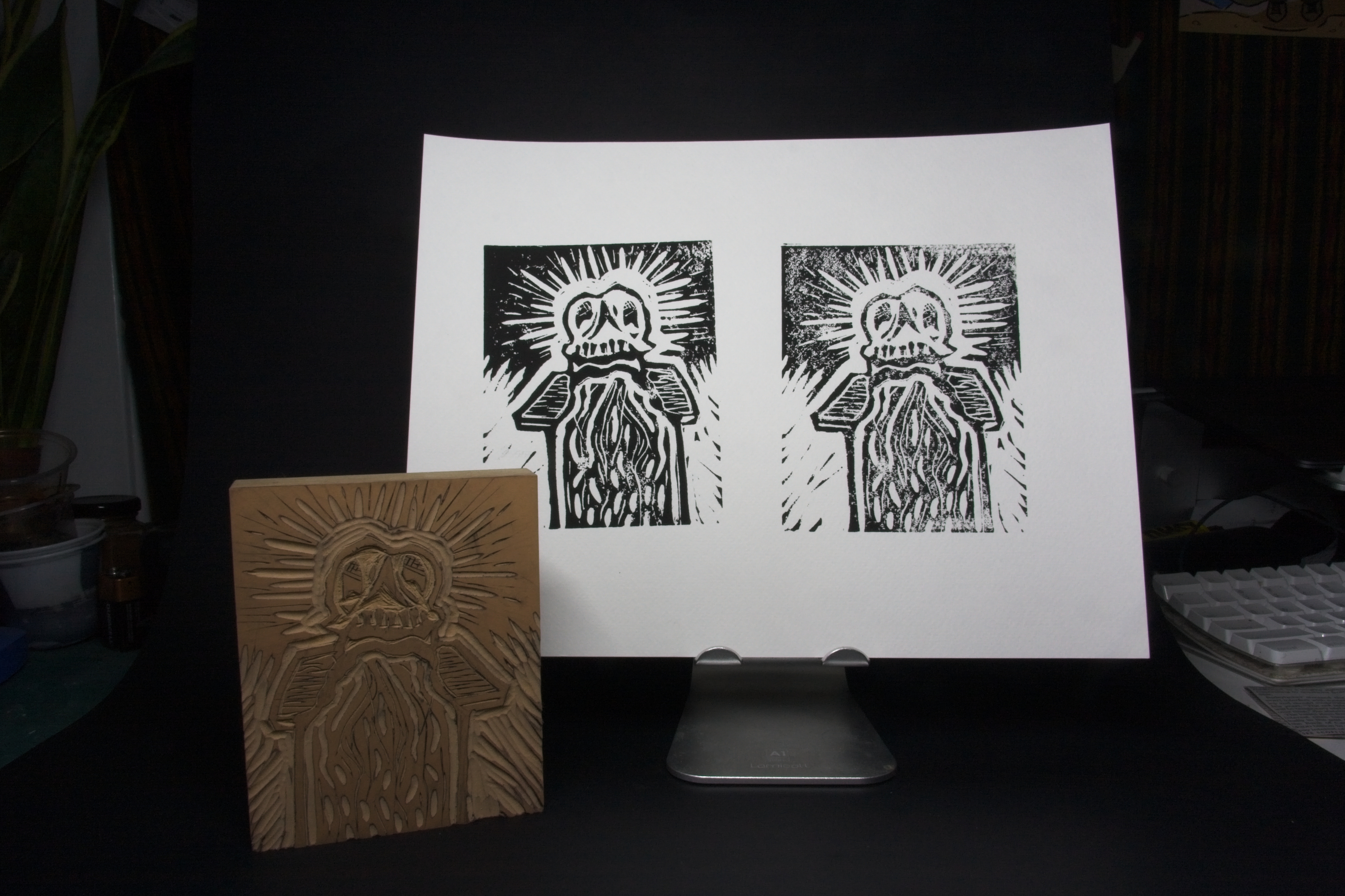 2 Skull lino prints on one piece of paper