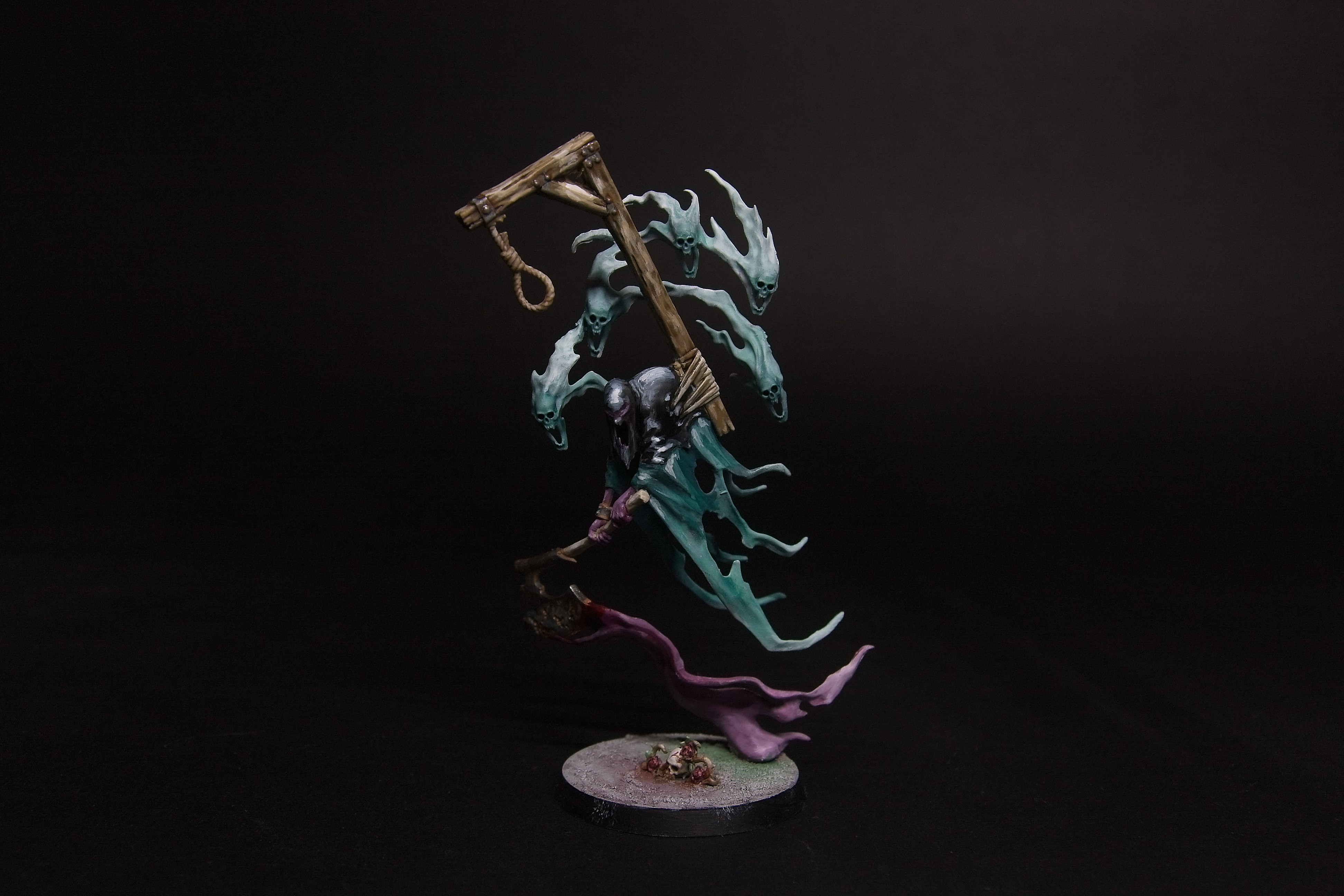 A Lord Executioner, weilding a bloody axe, weighed down by a hangman's post, with a swarm of spirits trailing behind.