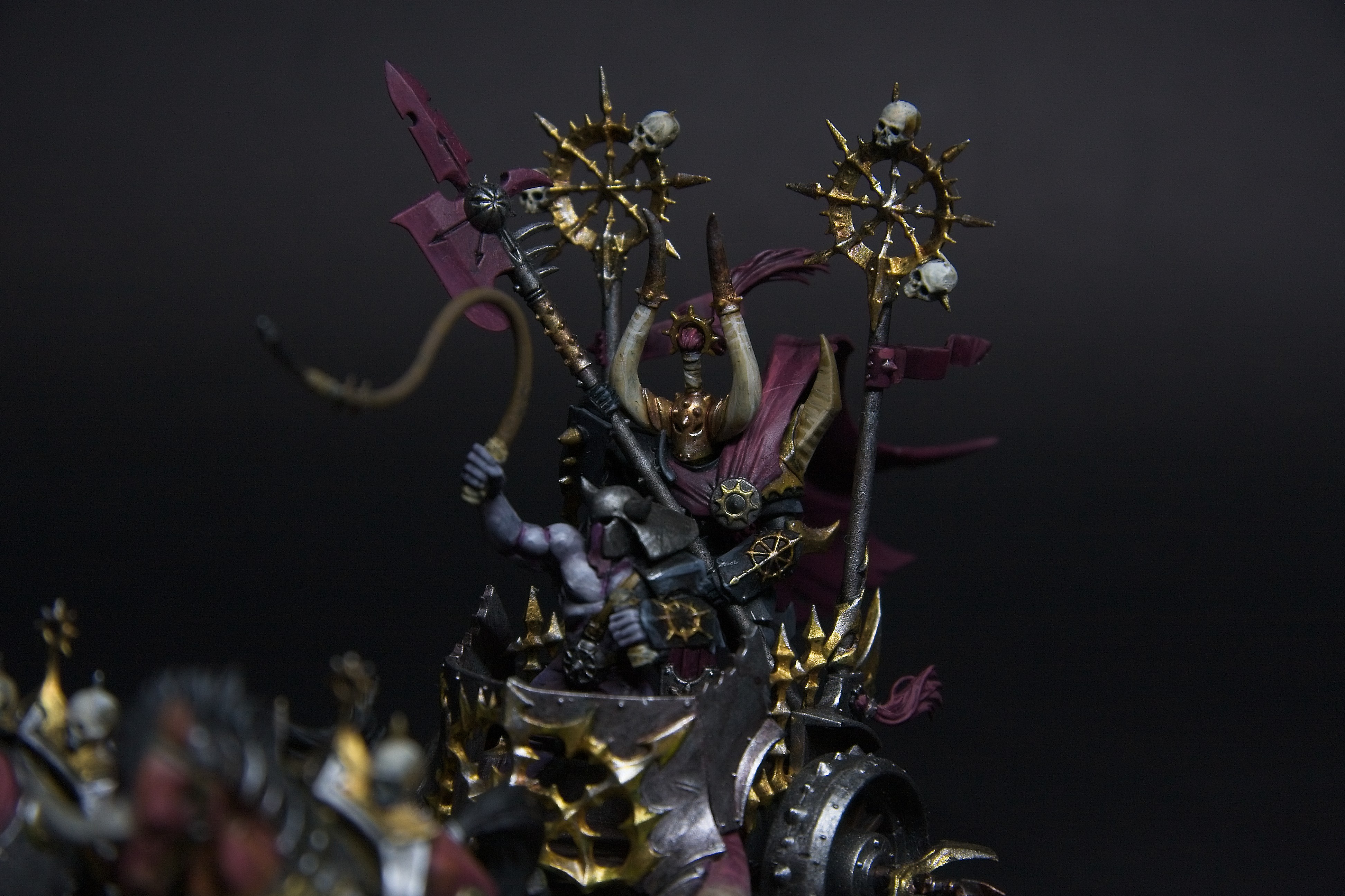 Highlights of gold in between the dark black and red armor.