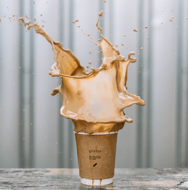 a splashing coffee cup