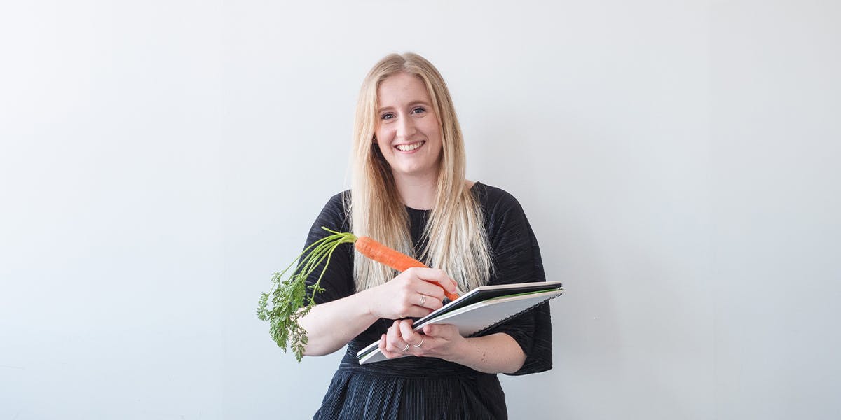 katie writing with a carrot 