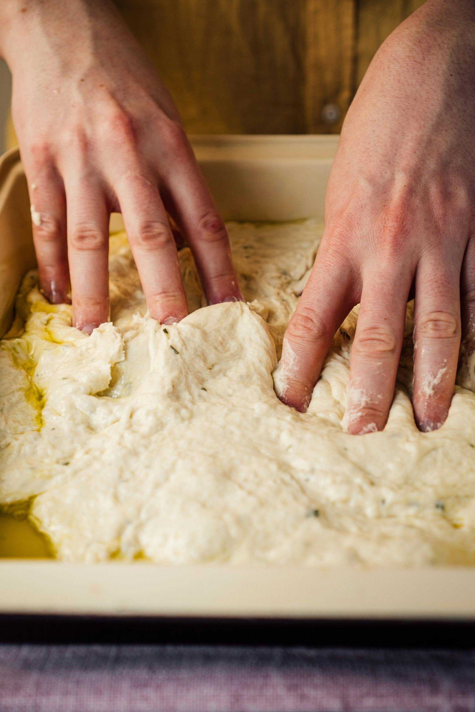 someone making focaccia