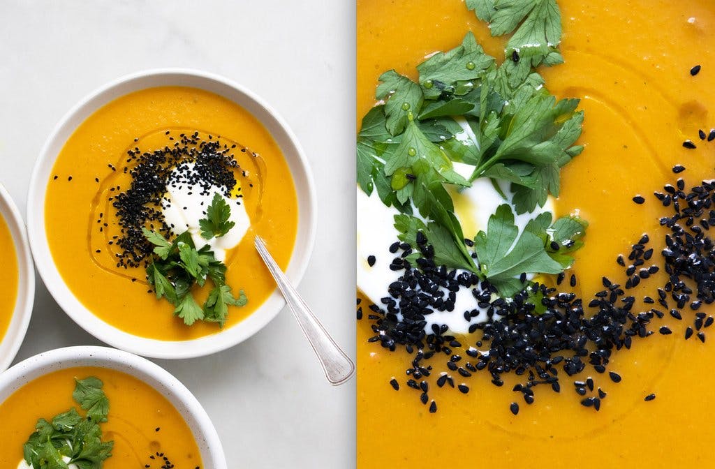 spiced carrot and butternut squash soup in white bowl