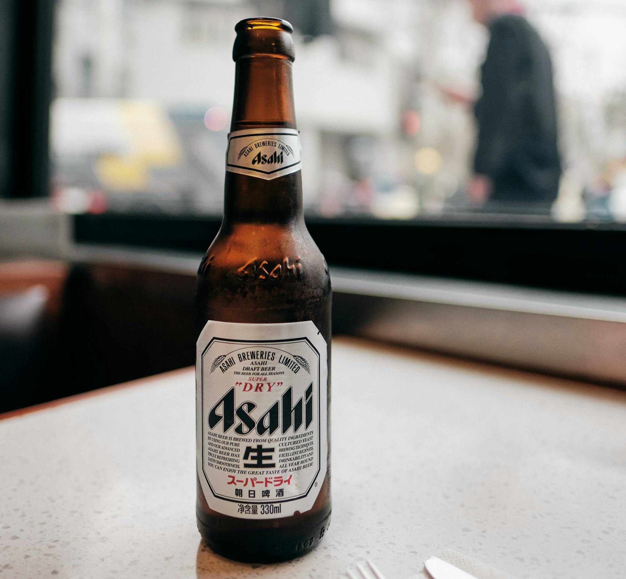 Bottle of Asahi Beer on table