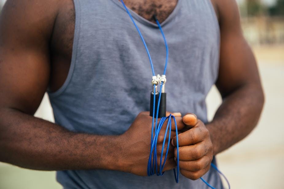 man holding skipping rope