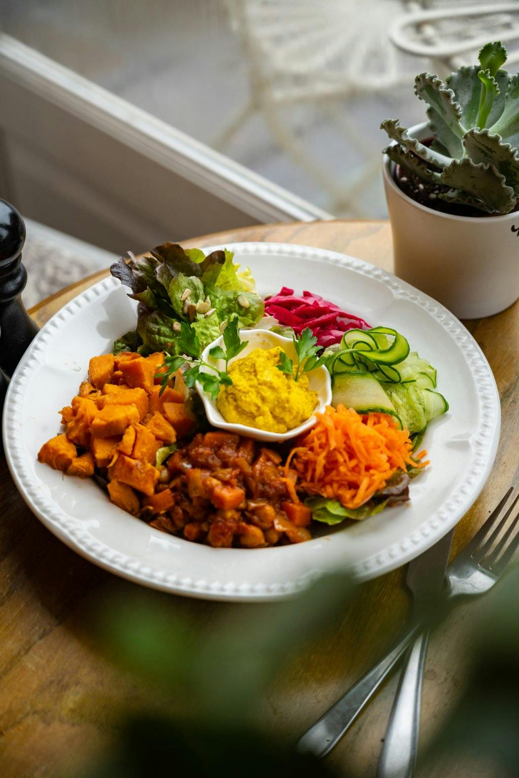 Plate of brightly coloured foods 