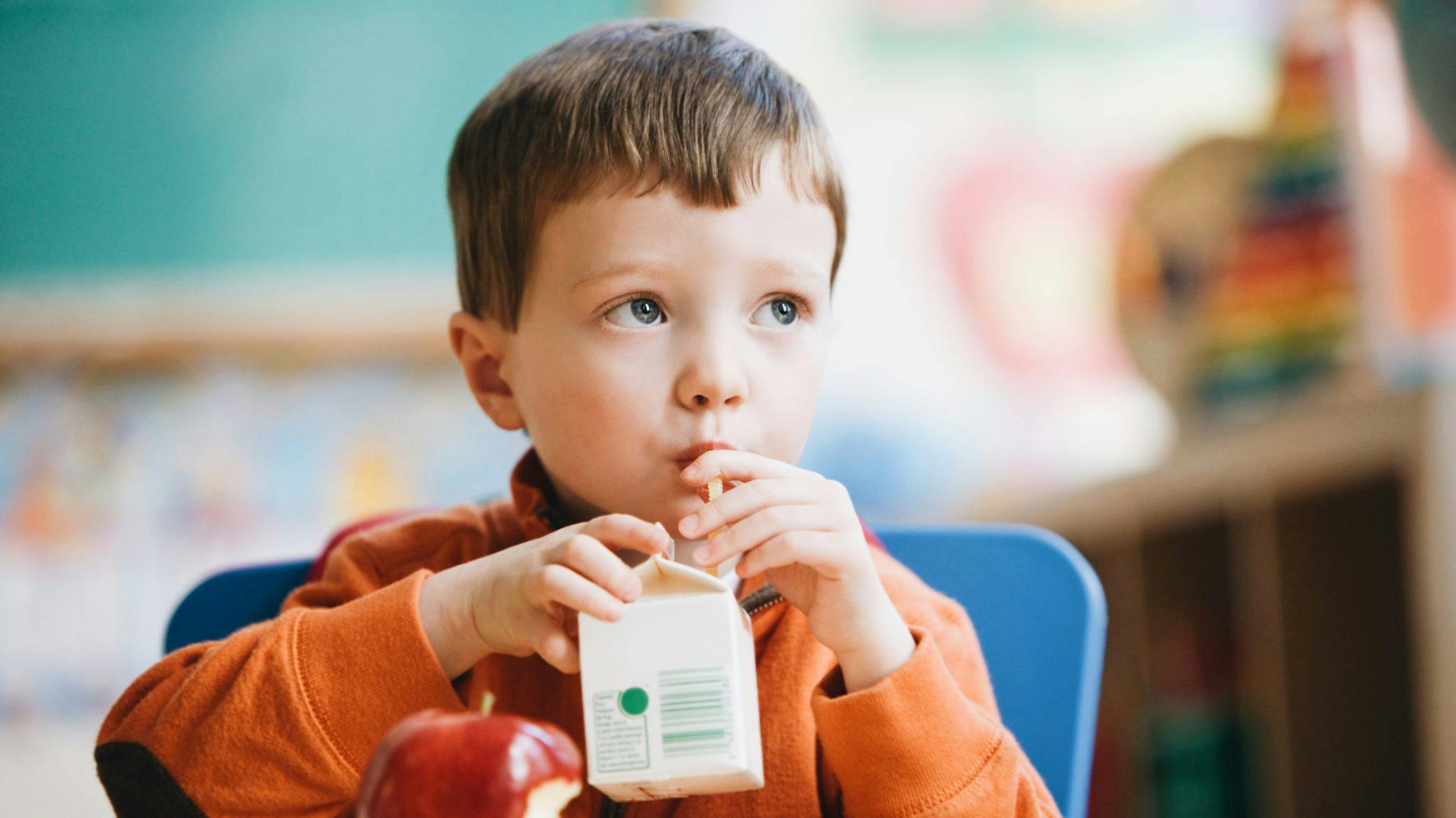 small child drinking milk