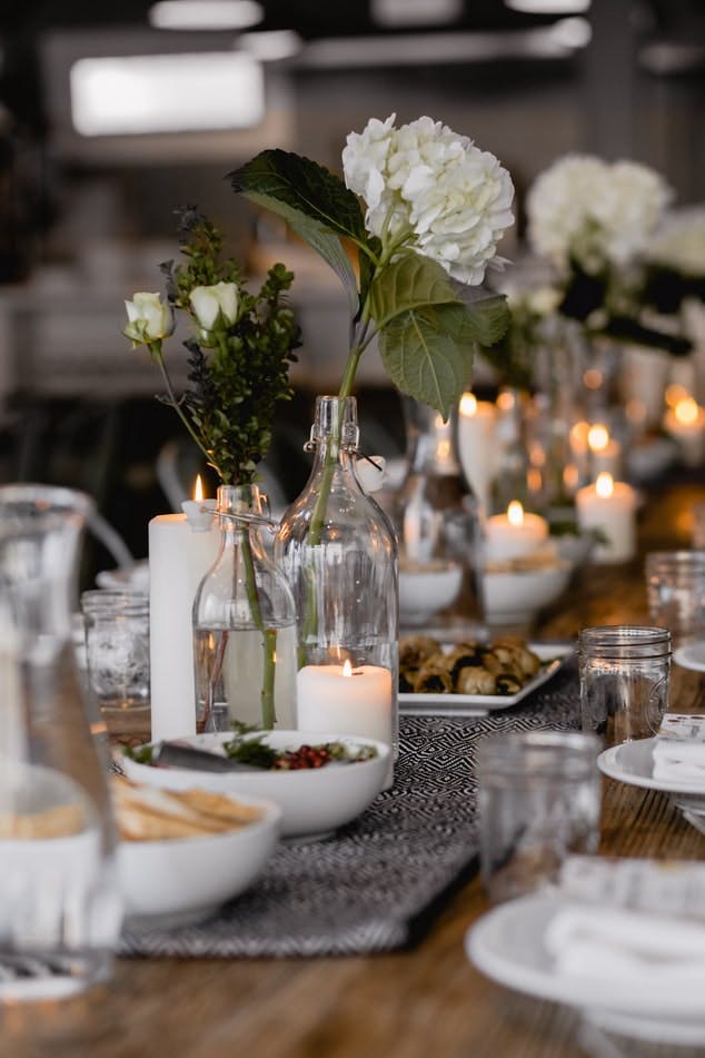 table settings with candles and flowers