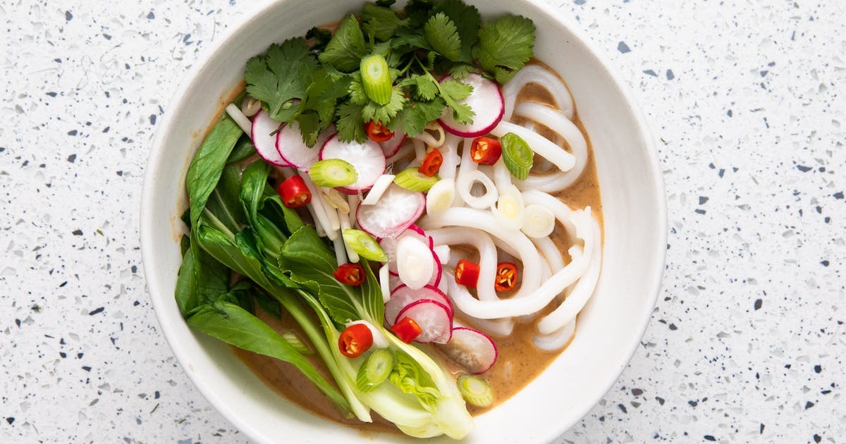 Thai peanut soup in white bowl