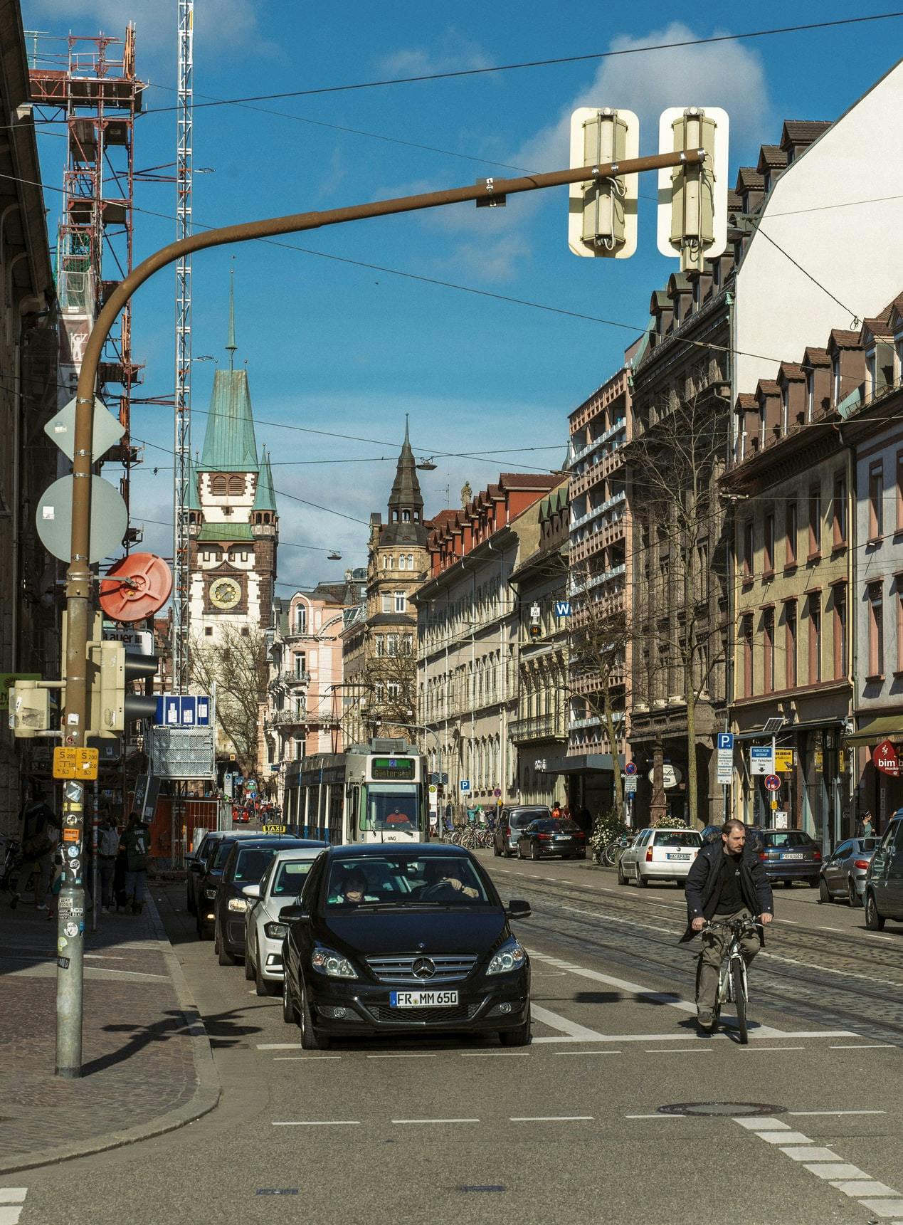 cyclist and tram on street in Freiburg