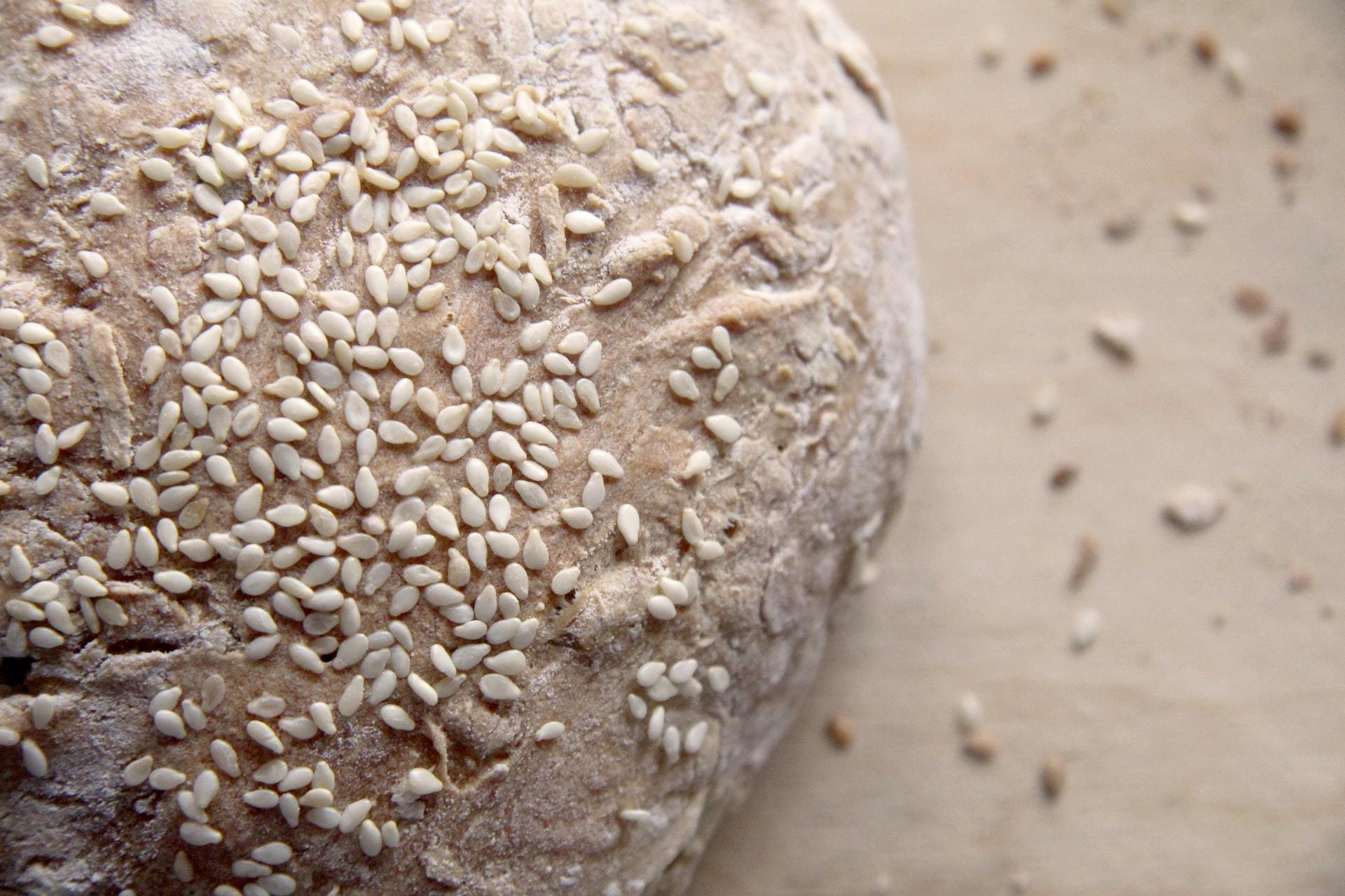 a bread dough covered in sesame seeds