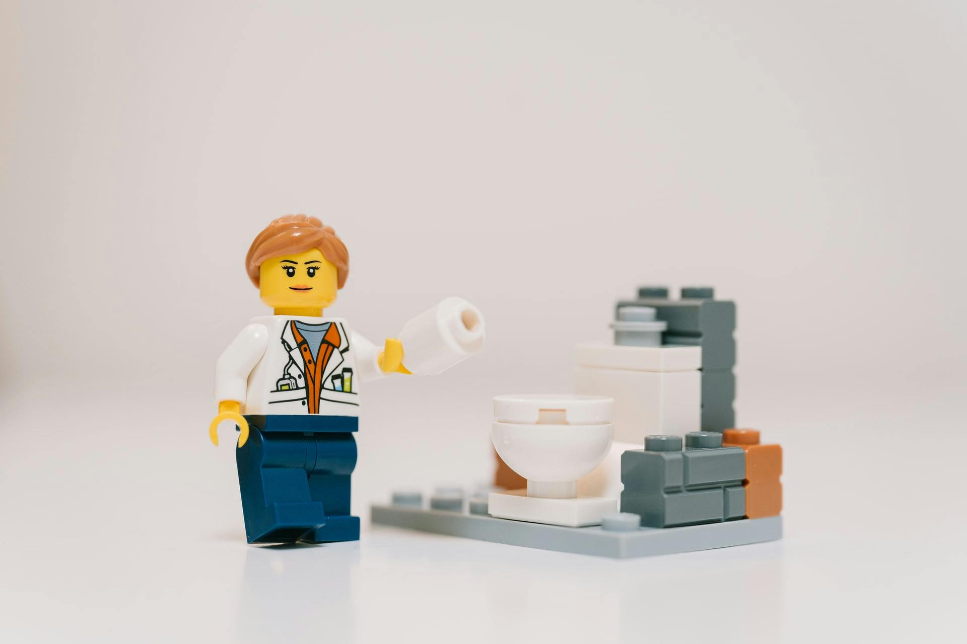 lego person and a lego toilet