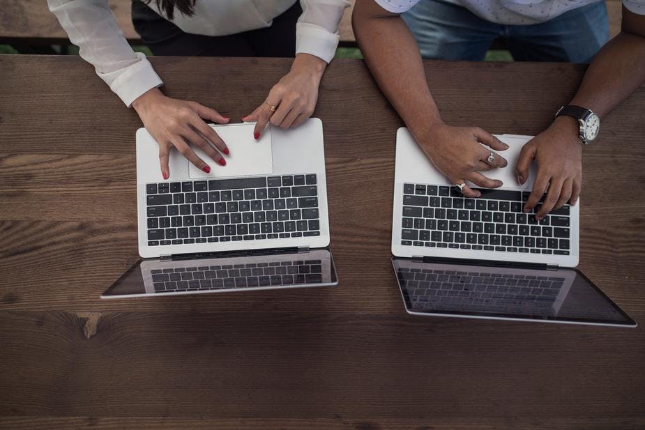 coworkers on laptops