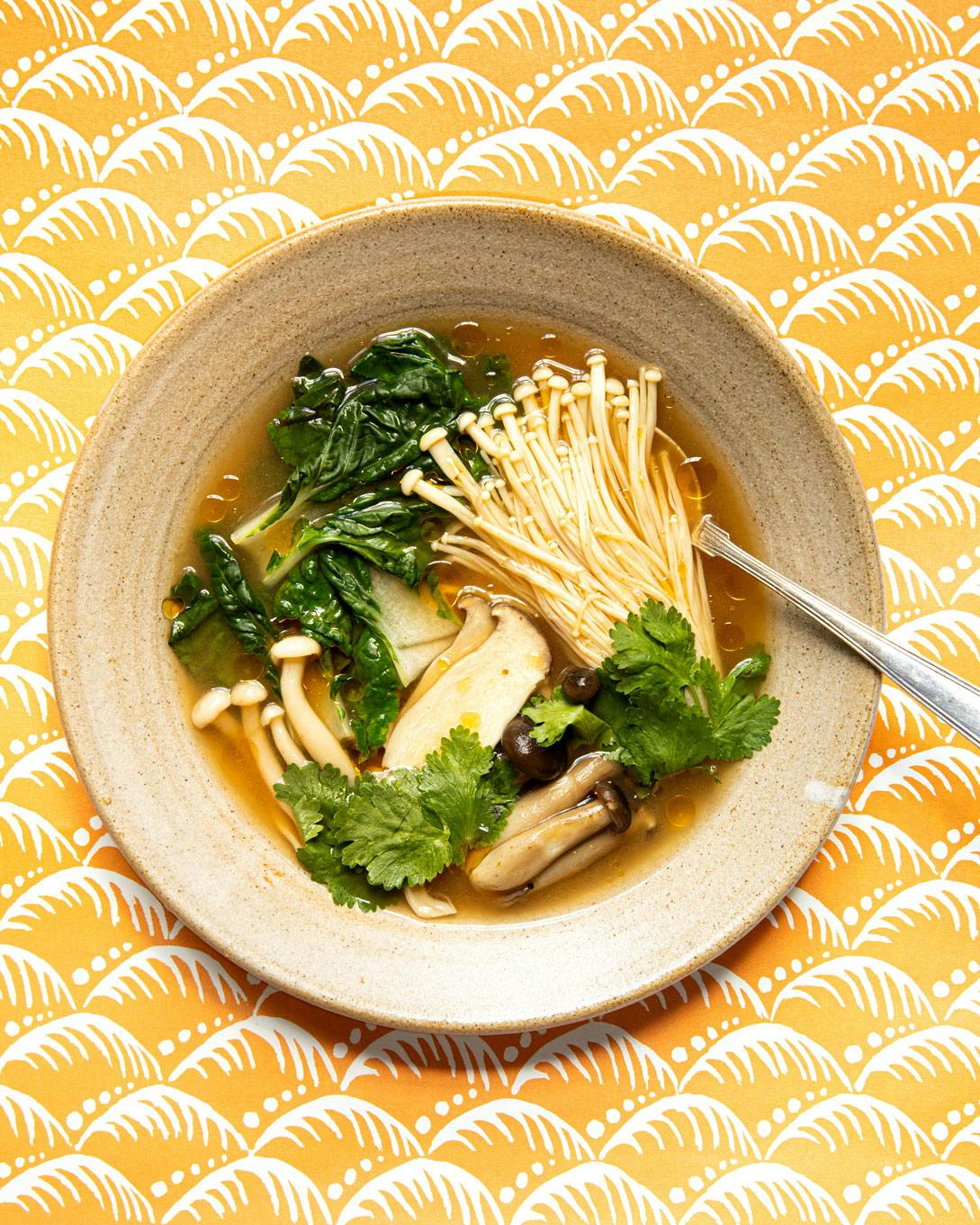 tom yum soup on yellow patterned background
