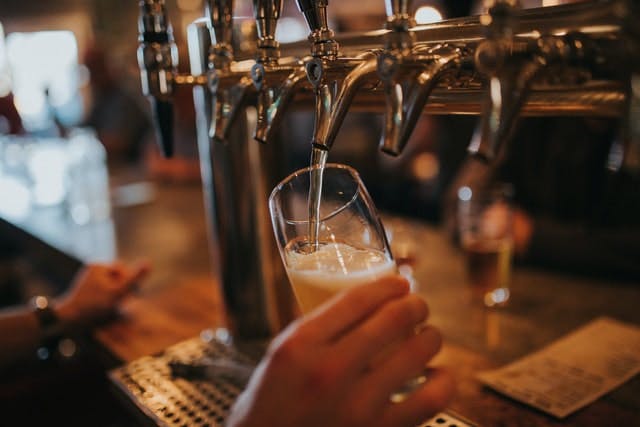 pulling a pint at the bar