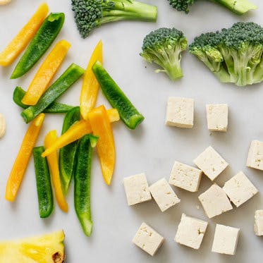 tofu, peppers, and broccoli on table 