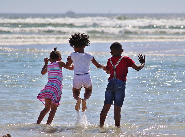 children playing at the beach