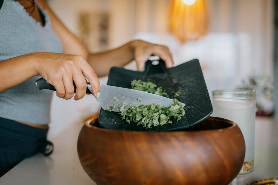 serving kale into a bowl