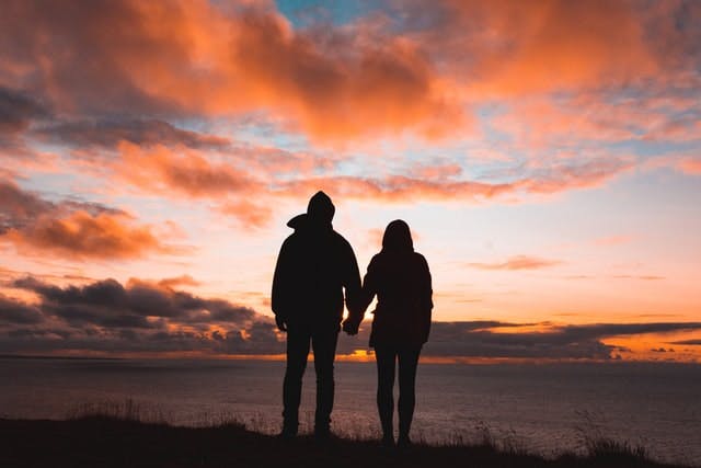 couple in front of a sunset