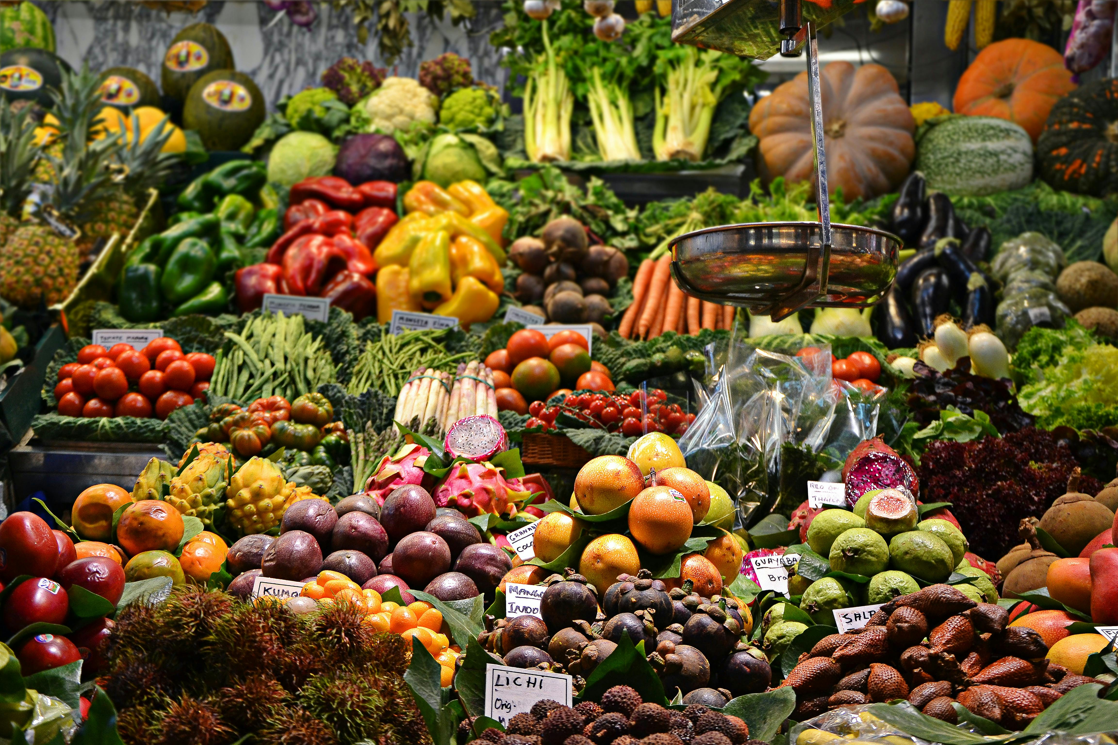 a loaded market stall of vegetables