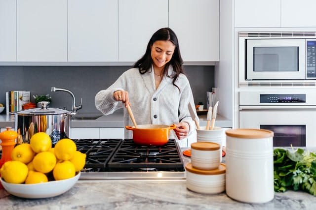 person cooking in kitchen