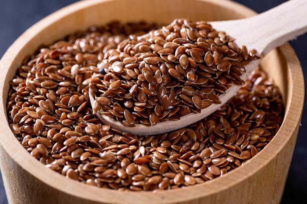 flaxseeds in bowl with spoon