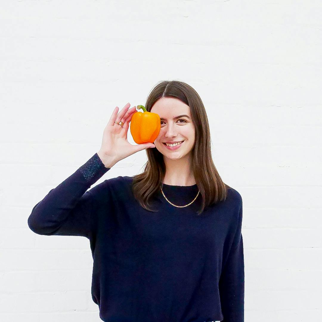 Emily H holding a pepper